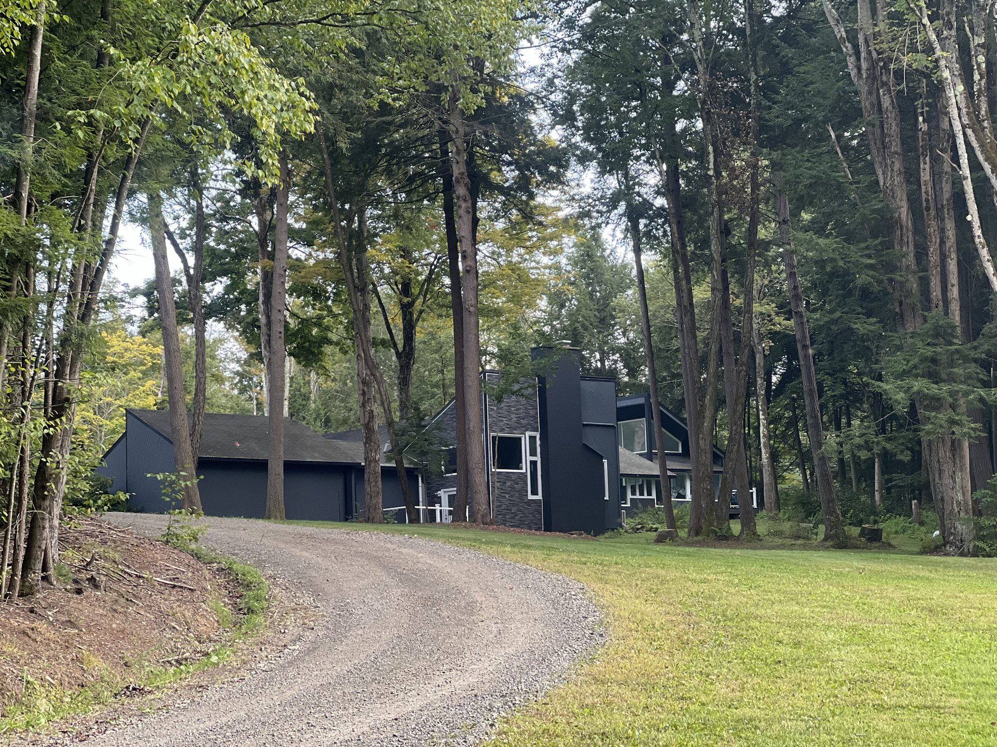 A gravel driveway running up to a house